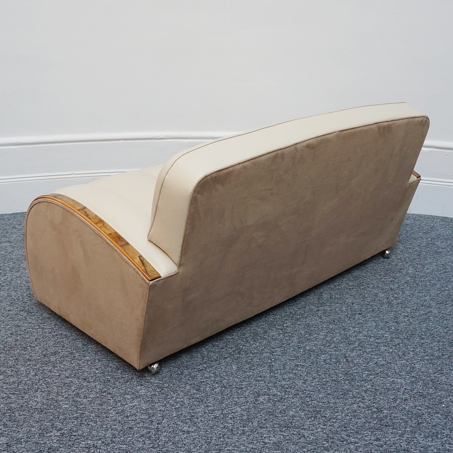 An Art Deco three piece tank suite by Heals of london. Made of Burr and solid walnut banding with reeded lower section, Upholstered in cream leather and contrasting faux suede