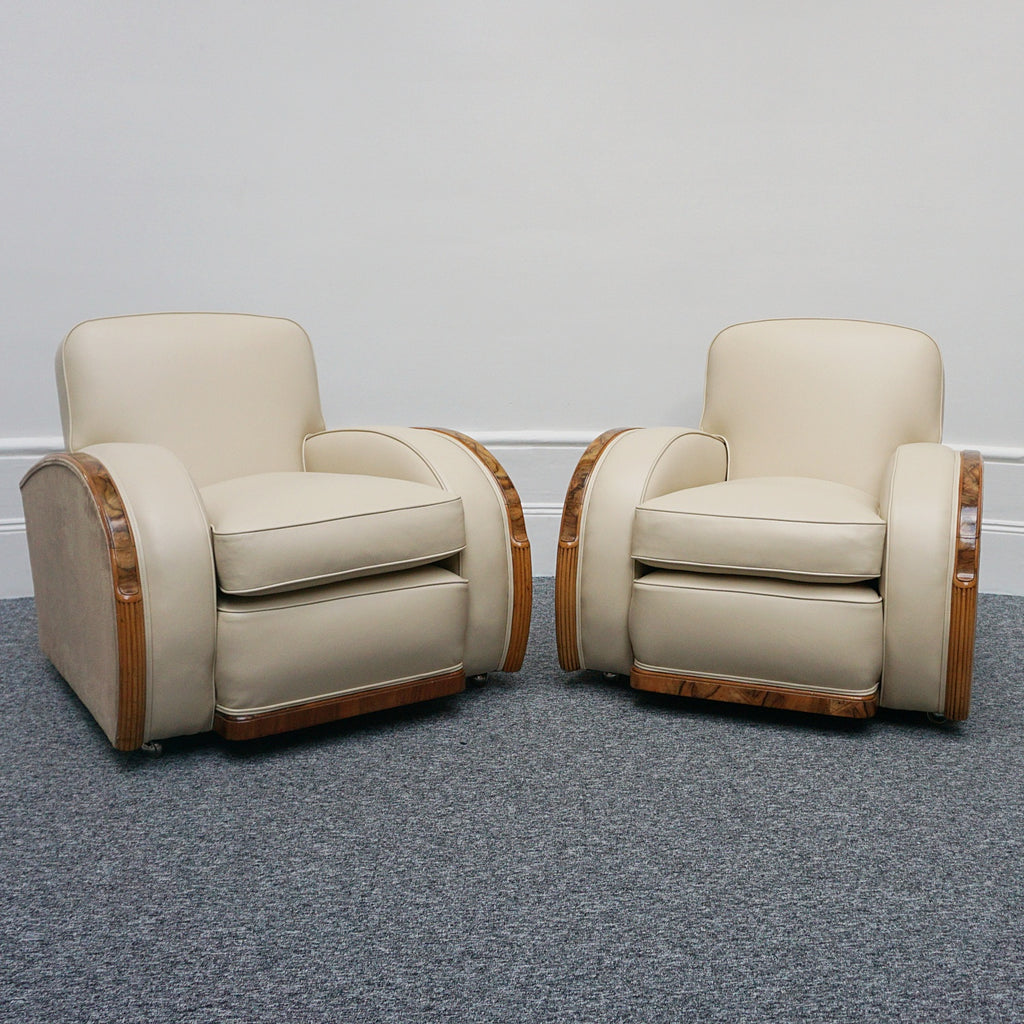 An Art Deco three piece tank suite by Heals of london. Made of Burr and solid walnut banding with reeded lower section, Upholstered in cream leather and contrasting faux suede