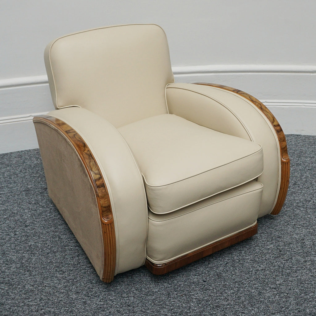 An Art Deco three piece tank suite by Heals of london. Made of Burr and solid walnut banding with reeded lower section, Upholstered in cream leather and contrasting faux suede