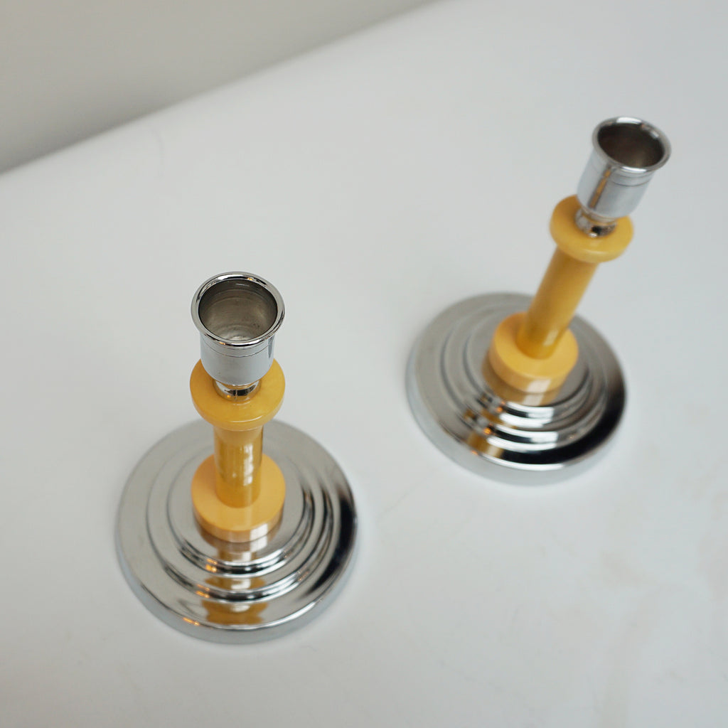A pair of Art Deco candlesticks. Yellow bakelite stem with dual bakelite rings. Jeroen Markies Art Deco