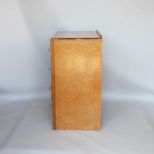 Art Deco chest of drawers in birdseye maple with walnut banding at Jeroen Markies 