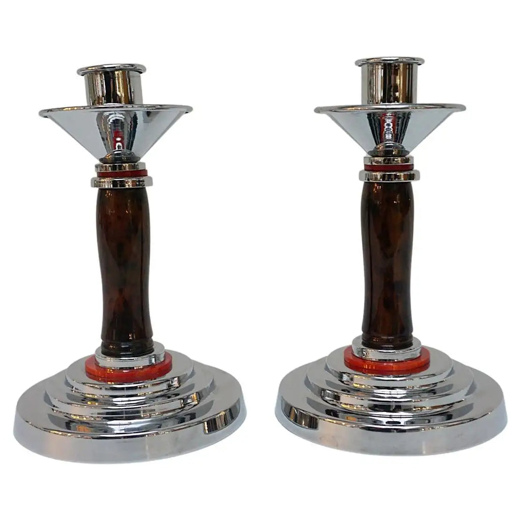 A pair of Art Deco candlesticks. Brown bakelite stem with red bakelite rings. Jeroen Markies Art Deco.
