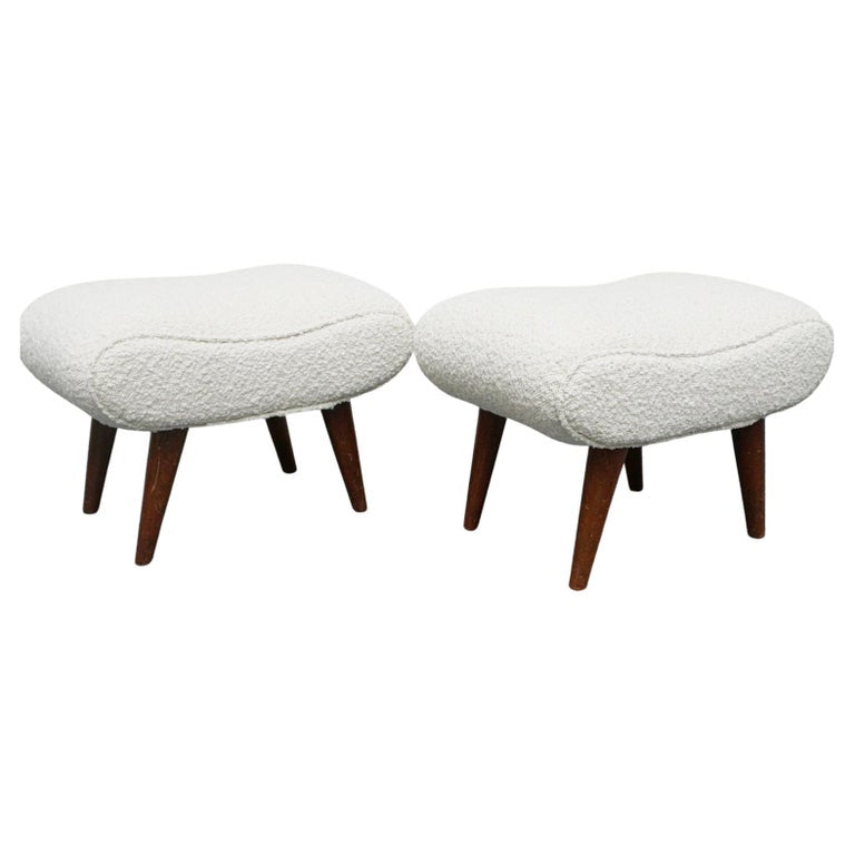  A Pair of Mid Century Footstools  re-upholstered in white Bouclé with tapered teak feet